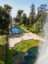 Scenic view of swimming pool by lake against sky