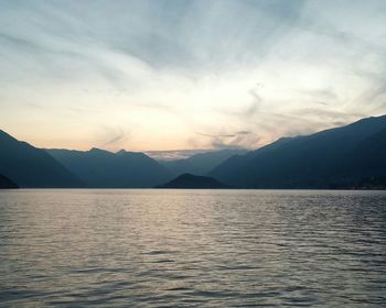 Scenic view of lake against cloudy sky