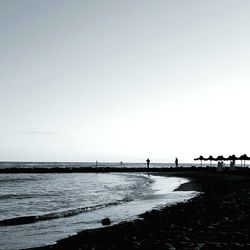 View of beach against clear sky
