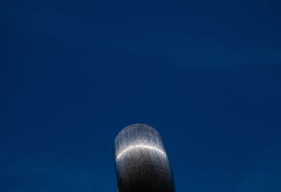 Low angle view of built structure against clear blue sky