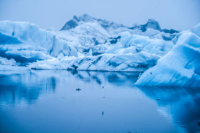 Scenic view of frozen lake against sky