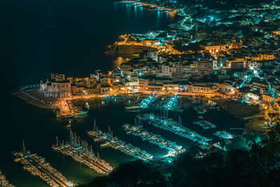 High angle view of illuminated buildings in city at night