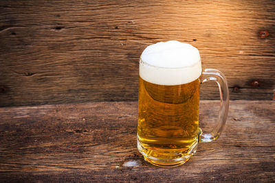 Close-up of beer glass on table