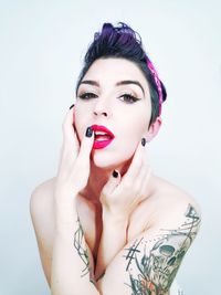 Portrait of a beautiful young woman over white background