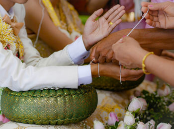 Close-up of hands holding cross