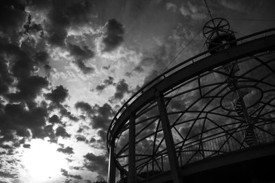 Low angle view of amusement park ride against sky