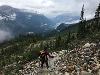 Full length of hiker standing on mountain