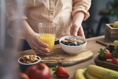 Midsection of man preparing food on table