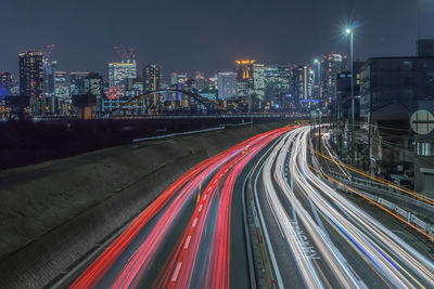 High angle view of light trails on city street at night