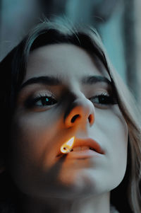 Close-up of young woman with eyes closed