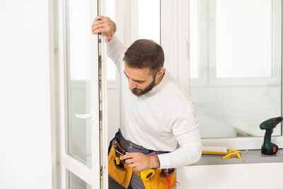 Side view of man working at home