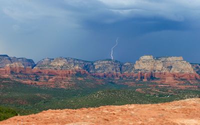 Idyllic view of lightning over rocky mountains