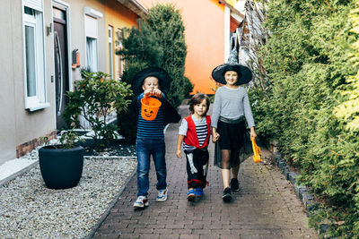 Halloween autumn holiday. a group of children in costumes dressed up for halloween 