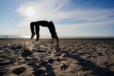 Full length of man on beach against sky