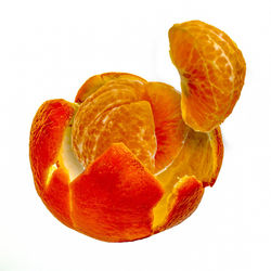 Close-up of orange slice against white background