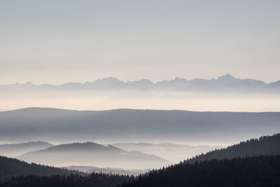 Scenic view of silhouette mountains against sky during sunset