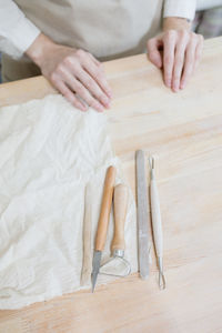 Midsection of man working on table