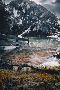 Scenic view of lake and mountain during winter