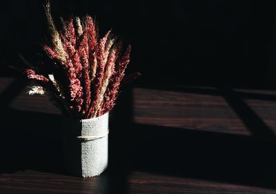 Close-up of red rose on table