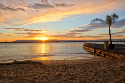 Scenic view of beach during sunset