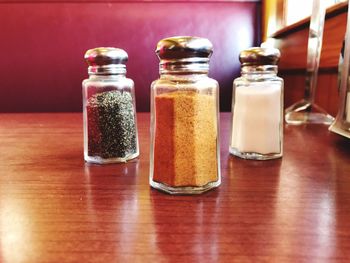 Close-up of pepper shaker on table