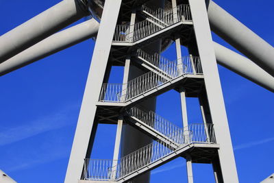 Low angle view of bridge against clear blue sky