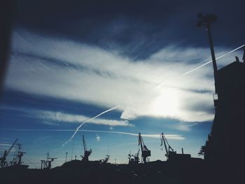 Low angle view of power lines against sky