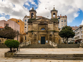 Facade of historic building against sky