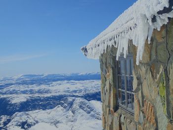 Scenic view of snow covered mountains