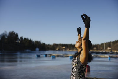 Woman preparing for swim at winter