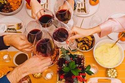 Cropped hands of woman preparing food on table