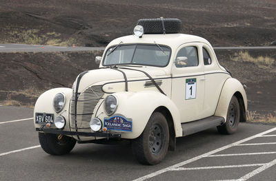 Vintage car parked on road