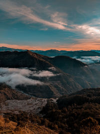 Scenic view of mountains against sky during sunset