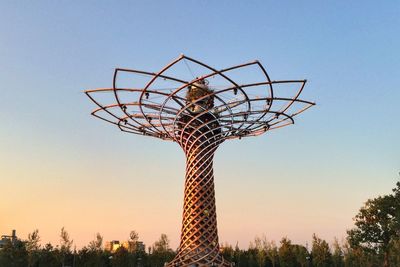 Low angle view of ferris wheel against clear sky