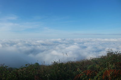 Scenic view of land against blue sky