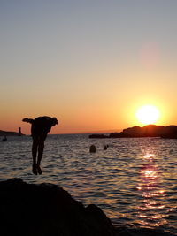 Scenic view of sea at sunset