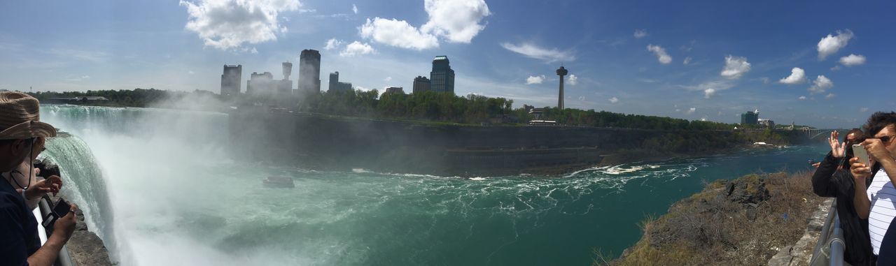 water, sky, lifestyles, leisure activity, panoramic, men, built structure, cloud - sky, sea, architecture, building exterior, city, tourism, travel destinations, travel, tourist, cloud, nature