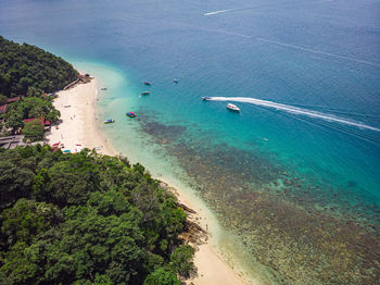 High angle view of sailboats on sea shore