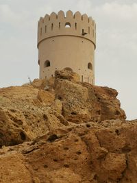 Low angle view of old ruins against sky