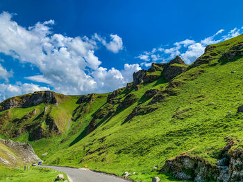 Panoramic view of green landscape against sky