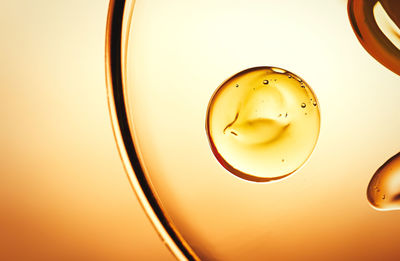 Golden gel texture on laboratory glass