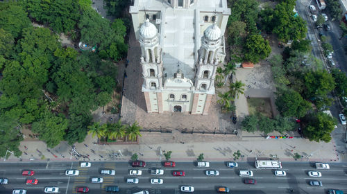 High angle view of cars on road by building