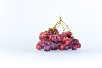 Close-up of grapes against white background