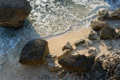 View of the beach in bali, taken from the top of the cliff