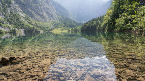 Crystal clear alpine lake surrounded by beautiful nature, wide view, obersee, germany