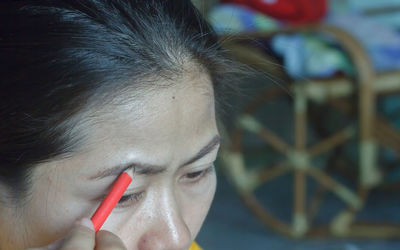 Close-up woman doing make-up