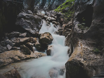 View of waterfall along rocks