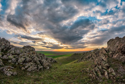 Scenic view of landscape against sky during sunset