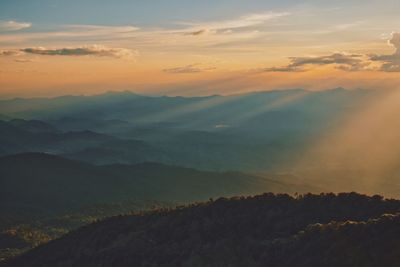 Scenic view of mountains against sky during sunset