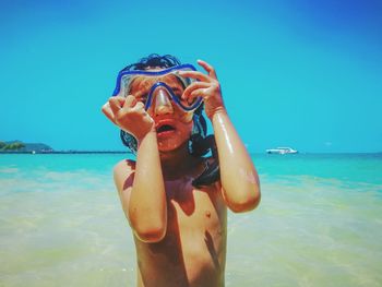 Shirtless girl wearing snorkel